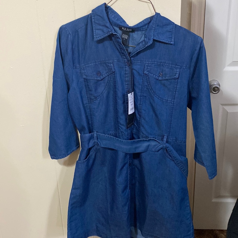 This is a blue dress,it has a denim look to it.